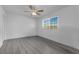 A simple empty bedroom featuring neutral floors, a ceiling fan, and a window with blinds at 3936 Savoy Ct, Las Vegas, NV 89115