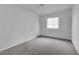 A simple yet comfortable empty bedroom featuring neutral carpet and a window with blinds at 3936 Savoy Ct, Las Vegas, NV 89115