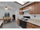 Kitchen featuring wood cabinets, laminate countertops, and modern lighting fixtures at 3936 Savoy Ct, Las Vegas, NV 89115