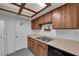 Kitchen featuring wood cabinets, laminate countertops and stainless steel sink at 3936 Savoy Ct, Las Vegas, NV 89115