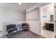 This open loft space features contemporary decor, including gray accent chairs and modern art at 406 Misterioso St, Henderson, NV 89011