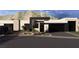 Contemporary home exterior with xeriscaping, a dark garage, and desert mountain views at 4317 Cameron Brook Ct, Las Vegas, NV 89129