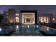 Stunning backyard pool reflecting the home's modern design and desert landscaping under a starlit sky at 4317 Cameron Brook Ct, Las Vegas, NV 89129