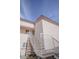 Exterior view of a condo building with a white staircase and a light pink exterior at 4555 E Sahara Ave # 231, Las Vegas, NV 89104