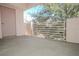 Open patio with a concrete floor and a wrought iron railing with views of trees at 4555 E Sahara Ave # 231, Las Vegas, NV 89104