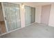 Spacious covered patio with sliding glass doors and a exterior door at 4555 E Sahara Ave # 231, Las Vegas, NV 89104