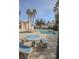 Community pool and hot tub with outdoor seating and plenty of sunshine at 4555 E Sahara Ave # 231, Las Vegas, NV 89104