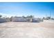 View of home with solar panels in expansive backyard with block wall fencing at 4746 Rosalie Cir, North Las Vegas, NV 89031