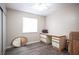 Spare bedroom with wood-look floors, a large closet with sliding doors, and an overhead light fixture at 4746 Rosalie Cir, North Las Vegas, NV 89031