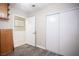 This spare bedroom includes wood-look floors, a large closet with sliding doors, and an overhead light fixture at 4746 Rosalie Cir, North Las Vegas, NV 89031