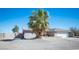 Inviting home exterior featuring desert landscaping, a spacious driveway, and a two-car garage at 4746 Rosalie Cir, North Las Vegas, NV 89031