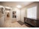 Inviting hallway featuring tile flooring and an entry door to the home at 4746 Rosalie Cir, North Las Vegas, NV 89031