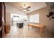 Bright kitchen features stainless appliances, island, and an adjacent dining area with a ceiling fan at 4746 Rosalie Cir, North Las Vegas, NV 89031