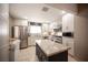 Bright kitchen with stainless steel appliances, modern cabinets, and a large island at 4746 Rosalie Cir, North Las Vegas, NV 89031