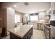 Bright kitchen with stainless steel appliances, modern cabinets, and a large island at 4746 Rosalie Cir, North Las Vegas, NV 89031