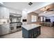 Modern kitchen featuring a large island with granite countertops and stainless steel appliances at 4746 Rosalie Cir, North Las Vegas, NV 89031