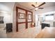 Open kitchen and dining area features decorative wood accents and views to the entry area at 4746 Rosalie Cir, North Las Vegas, NV 89031