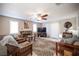 Open living room featuring a fireplace, tile floors, and stylish furniture at 4746 Rosalie Cir, North Las Vegas, NV 89031