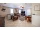 Living room with a ceiling fan, fireplace, tile floors and natural light at 4746 Rosalie Cir, North Las Vegas, NV 89031