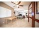 Open-concept living room and dining area feature neutral colors and a view to the kitchen at 4746 Rosalie Cir, North Las Vegas, NV 89031