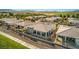 Aerial view of homes with tile roofs, covered patios, and manicured landscaping at 4775 E Beacon Ridge Dr, Pahrump, NV 89061