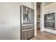 Kitchen with stainless steel refrigerator, granite countertops, white cabinets, and tile flooring at 4775 E Beacon Ridge Dr, Pahrump, NV 89061