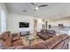 Spacious living room featuring modern furnishings and an open floor plan flowing into the kitchen at 4775 E Beacon Ridge Dr, Pahrump, NV 89061