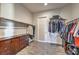 Large walk-in closet with shelving, wood tile flooring, and drawers at 4775 E Beacon Ridge Dr, Pahrump, NV 89061