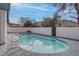 Sparkling backyard pool with a white block wall providing privacy at 4775 Monaco Rd, Las Vegas, NV 89121