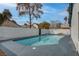 A refreshing swimming pool with clear blue water is surrounded by a backyard fence at 4775 Monaco Rd, Las Vegas, NV 89121