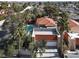 Aerial view of desert property features a private pool, garage, and mature palm trees at 5102 Tennis Ct, Las Vegas, NV 89120