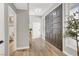 Hallway featuring light wood floors and contrasting trim, doors, and decor at 5102 Tennis Ct, Las Vegas, NV 89120