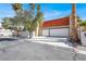 Charming two-story home featuring a two-car garage, red-tiled roof, and desert landscaping at 5102 Tennis Ct, Las Vegas, NV 89120