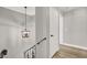 Bright hallway with modern lighting and neutral tones, offering a clean and welcoming transition between rooms at 5102 Tennis Ct, Las Vegas, NV 89120