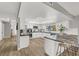 Bright kitchen featuring white cabinetry and modern appliances, with an island with seating at 5102 Tennis Ct, Las Vegas, NV 89120