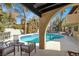 Inviting pool with patio seating, perfect for outdoor relaxation and entertaining at 5102 Tennis Ct, Las Vegas, NV 89120