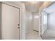 A hallway leading into a room, and featuring tile flooring, a closet, and a view of the front door at 5185 Briar Meadow Way, Las Vegas, NV 89118