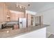 Spacious kitchen featuring stainless steel appliances and barstool seating at 5185 Briar Meadow Way, Las Vegas, NV 89118