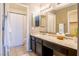 Bathroom featuring a granite countertop vanity, and framed mirror at 5330 Rod Ct # 202, Las Vegas, NV 89122