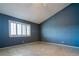 Bedroom with plantation shutters, tile floors, and a soothing wall color at 5330 Rod Ct # 202, Las Vegas, NV 89122