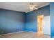 Bedroom with a ceiling fan, neutral walls, and en-suite bathroom at 5330 Rod Ct # 202, Las Vegas, NV 89122