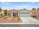 Charming single-story home with a well-maintained front yard and a spacious two-car garage at 5520 Cranwood Ct, Las Vegas, NV 89130