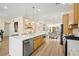 Kitchen features white countertops, wooden cabinets, stainless steel appliances, and views to dining area at 5520 Cranwood Ct, Las Vegas, NV 89130