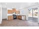 Bright kitchen featuring a full suite of appliances, ample cabinetry, and a sliding glass door at 5616 Dunshee Vista Ave, Las Vegas, NV 89131