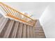 Modern wood staircase with white trim and baseboards at 5616 Dunshee Vista Ave, Las Vegas, NV 89131