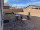 Backyard featuring gravel, patio furniture and a brick-paved patio area at 5980 E Drosetta Ave, Pahrump, NV 89061