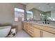 Bathroom with double sinks, decorative tile and soaking tub at 6009 Silvalde Ln, Las Vegas, NV 89135