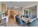 Charming dining area with a decorative wooden table and large sliding doors leading to the backyard patio at 6009 Silvalde Ln, Las Vegas, NV 89135