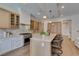 Modern kitchen design with stainless steel range, an oversized island, and wood cabinetry at 6009 Silvalde Ln, Las Vegas, NV 89135