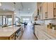 Well-lit kitchen featuring a large center island and stainless steel appliances at 6009 Silvalde Ln, Las Vegas, NV 89135